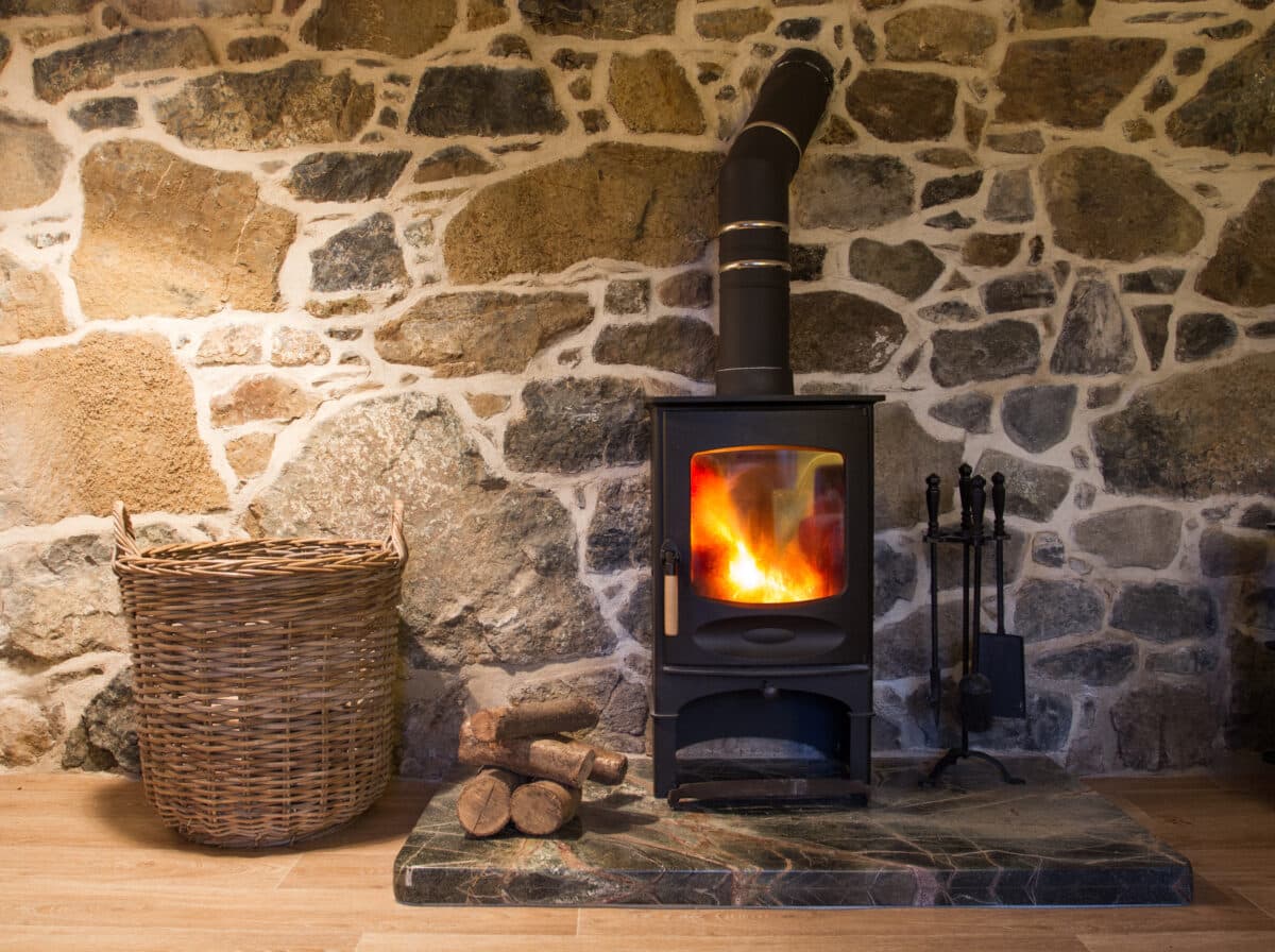 a wood burning stove fireplace in a cosy stone co 2022 11 11 06 52 35 utc (1)